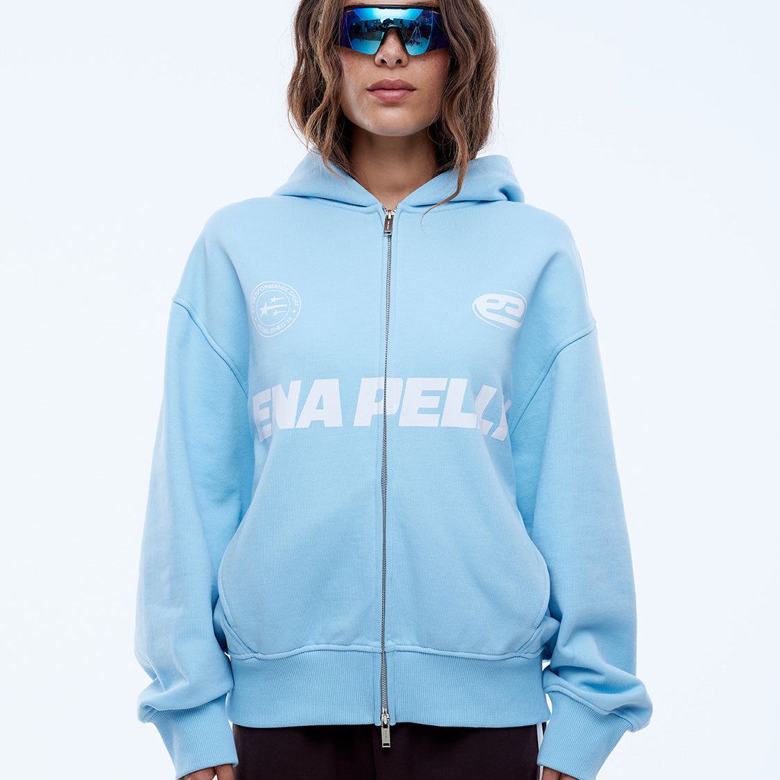 Full length front view of cloud blue multi logo zip hoodie with ribbed cuffs and hem
