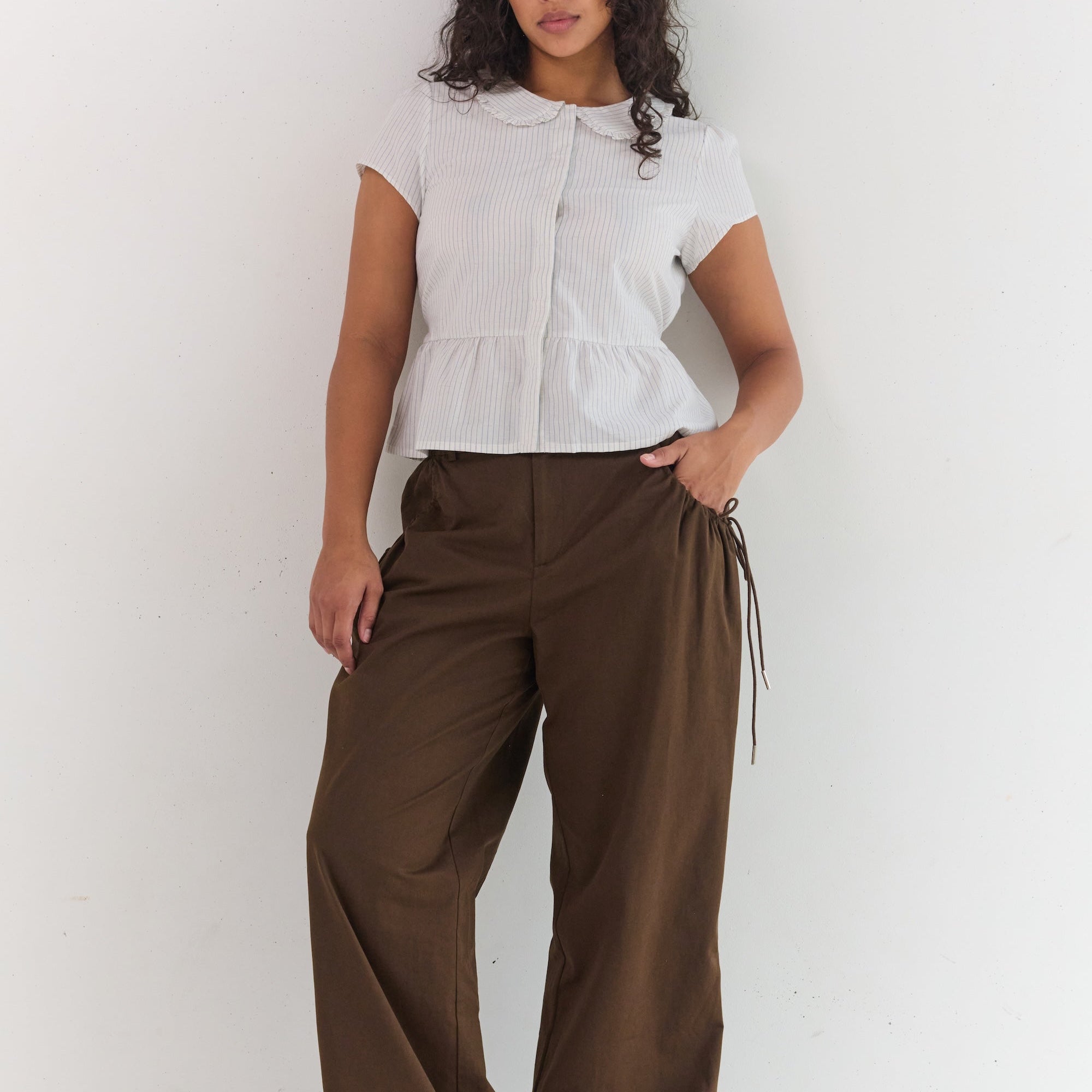 Relaxed fit espresso pants with ruched pocket detailing