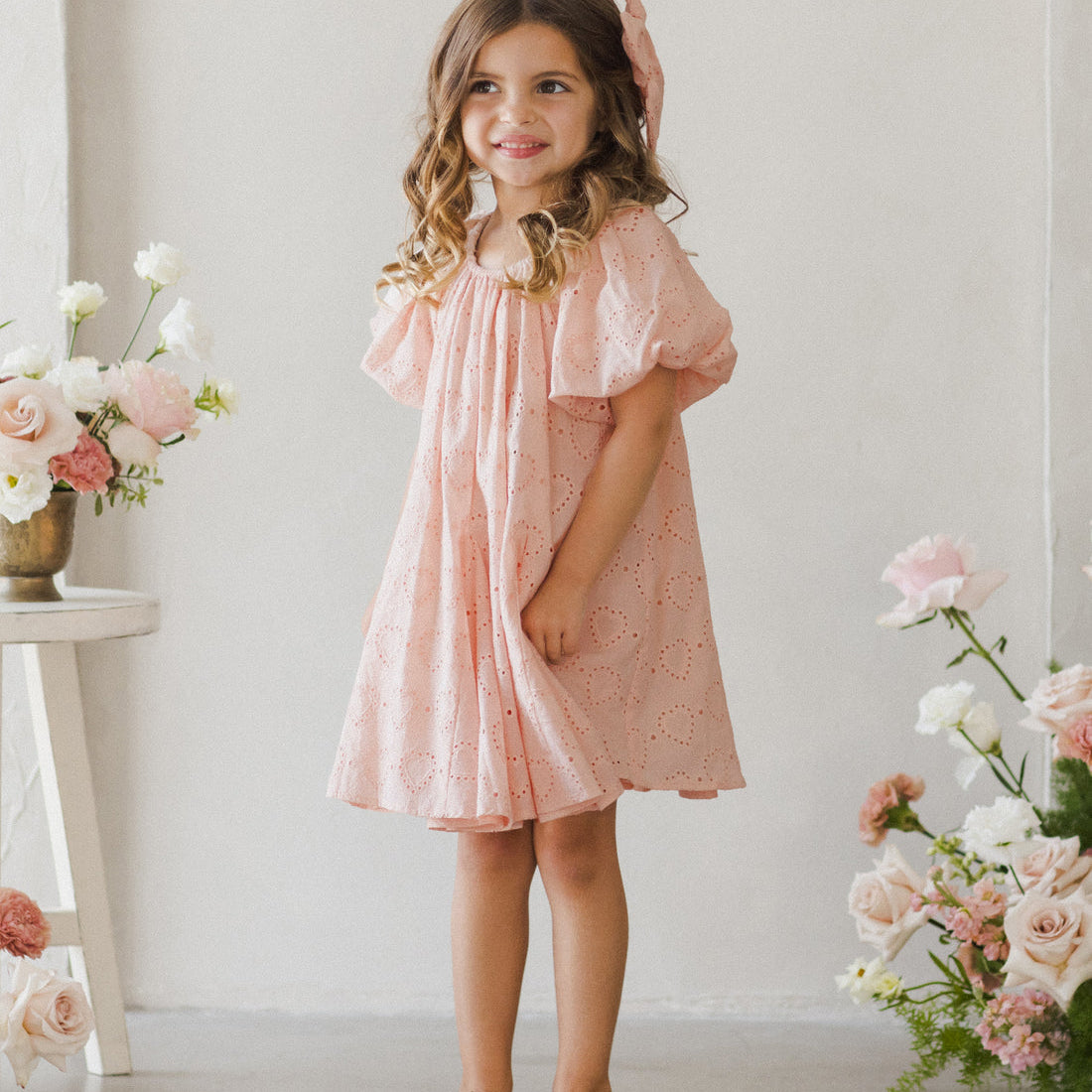 Pinks flowergirl dress with heart details and puff sleeves by Noralee