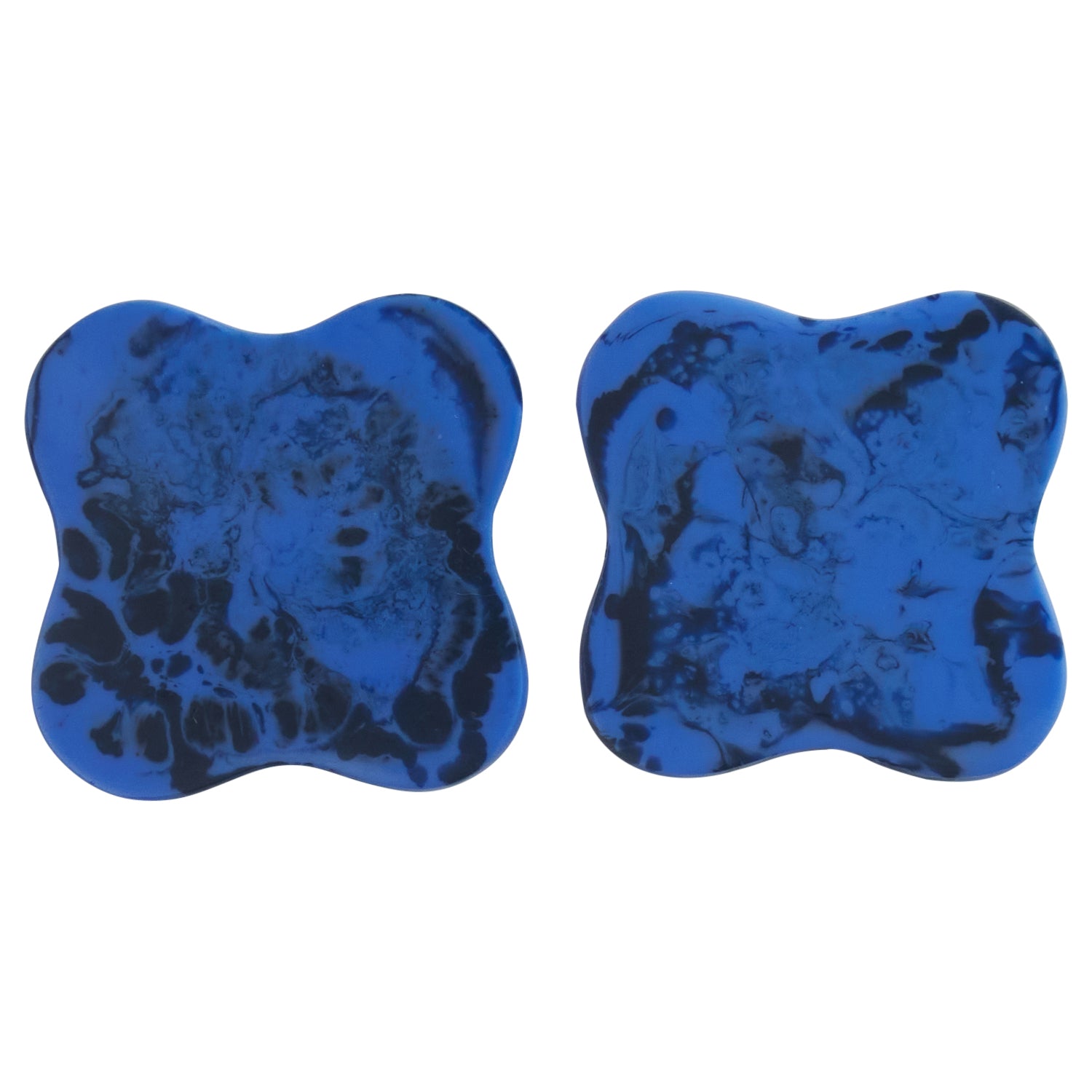 Set of 2 azure blue marbled resin coasters with curved square shape, dark navy swirl detail, front view