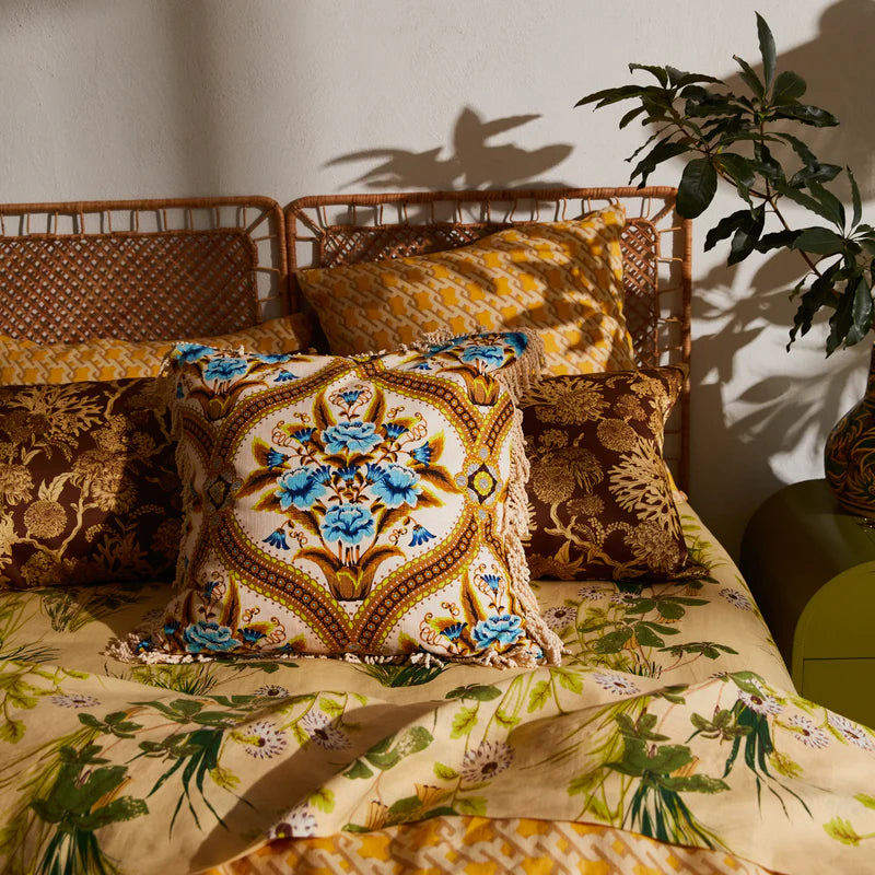 Margaret Fringe Cushion - Clay by Sage & Clare displayed on a bed