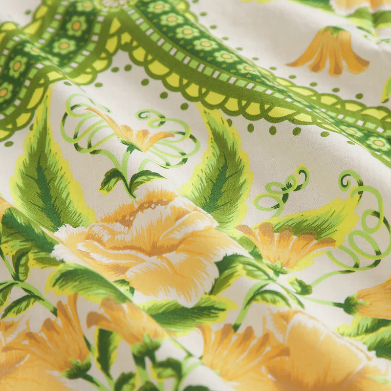 fabric detail of floral yellow and green print Margaret Cotton Quilt Cover - La Palma by Sage & Clare
