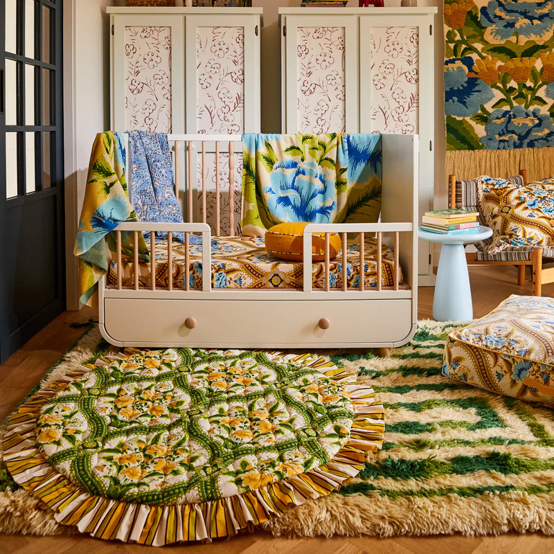 Margaret Play Mat by Sage & Clare reversible playmat with retro floral design in green and yellow on one side, and blue and yellow on the other side