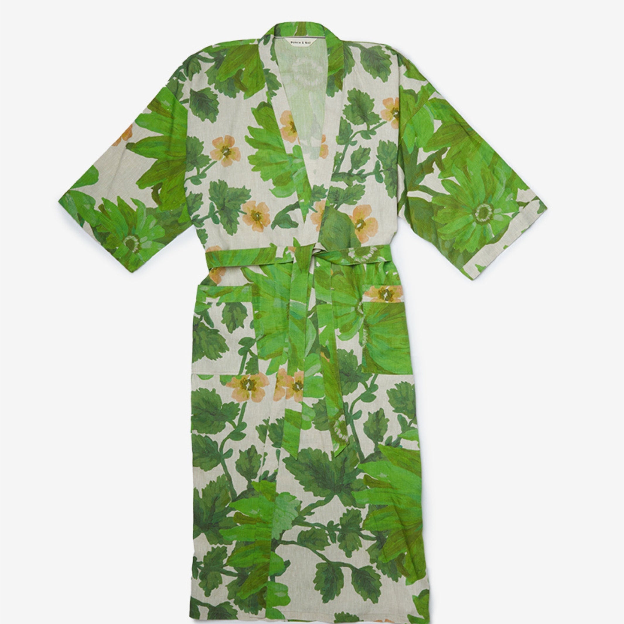 Front view of Marigold Leaf Linen Robe with green botanical print and yellow flowers showing tie belt closure