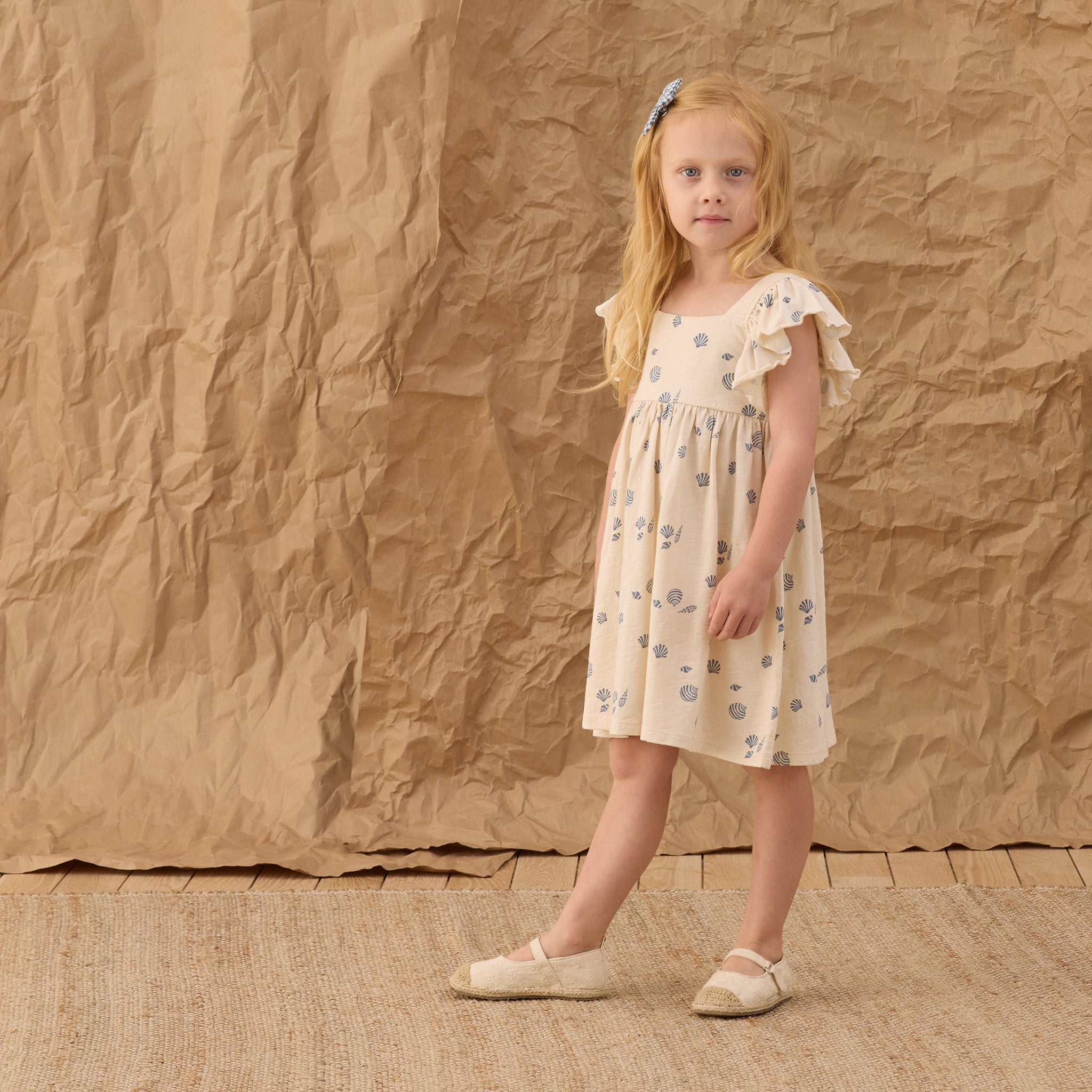 Girl wearing Mariposa Seashell Dress | Rylee + Cru