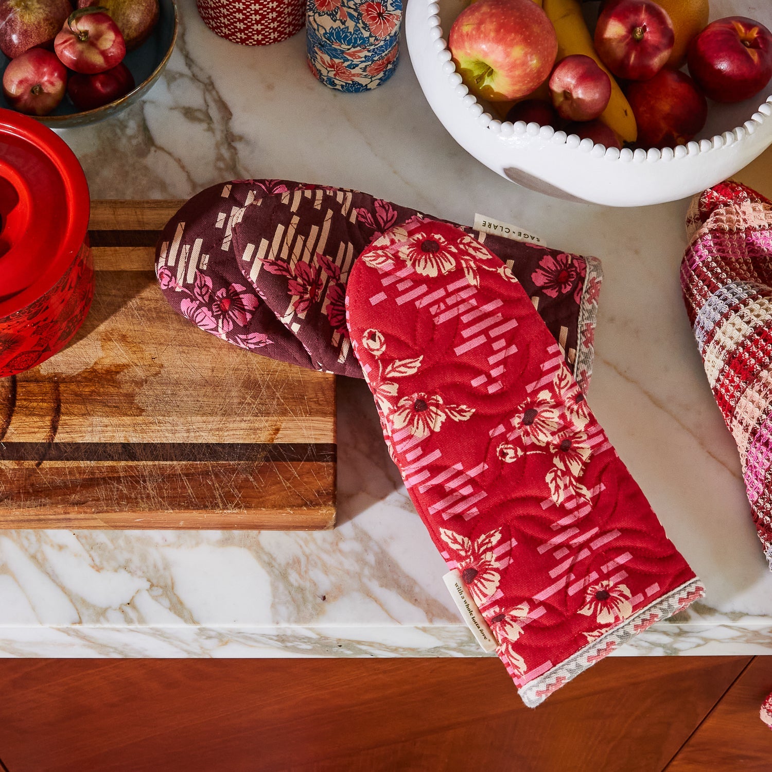 Marta Oven Mitt Set by Sage and Clare featuring red and burgundy floral patterns with heat protection