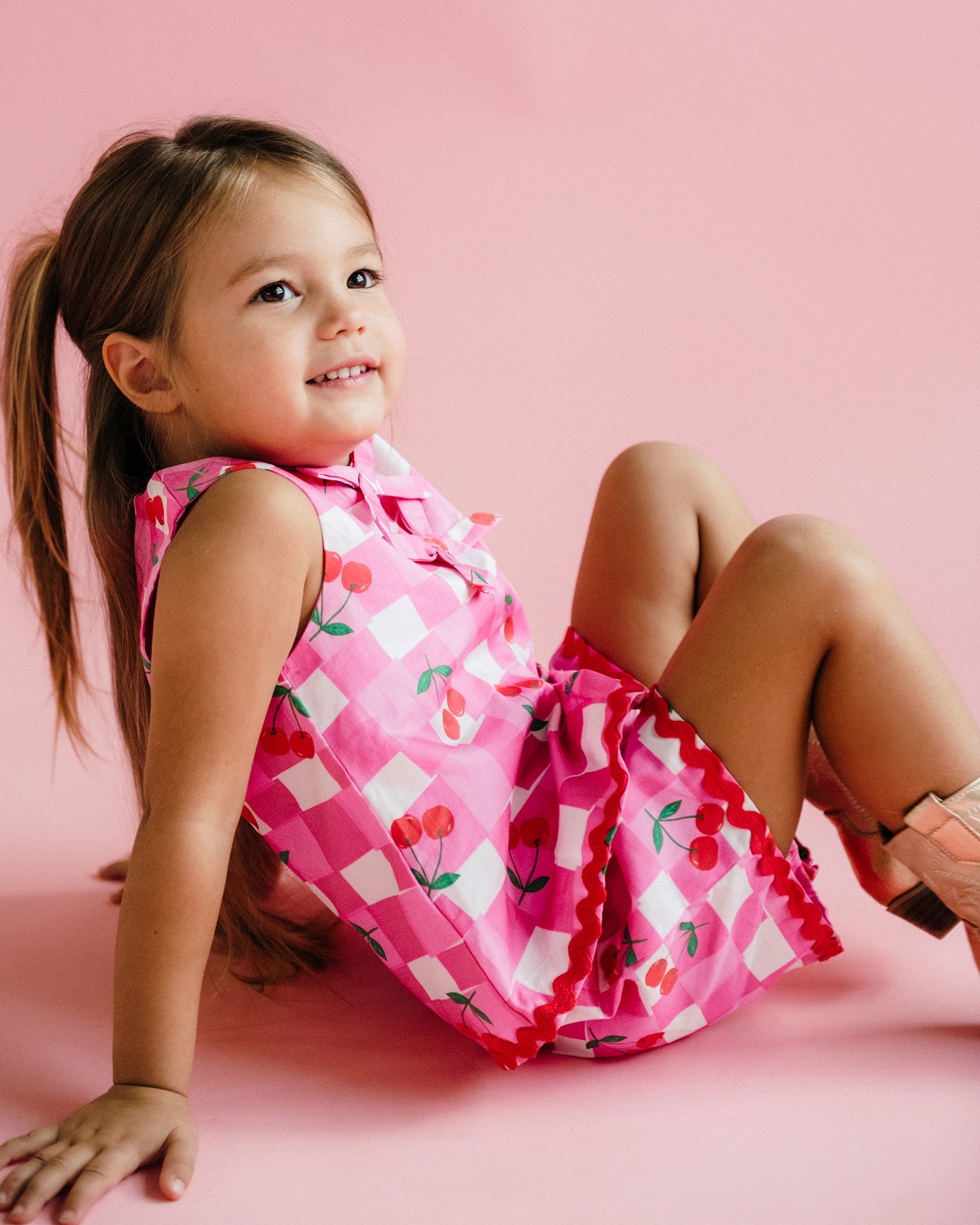 Side view of girl wearing the Mary Woven Set - Gingham | Rock Your Baby