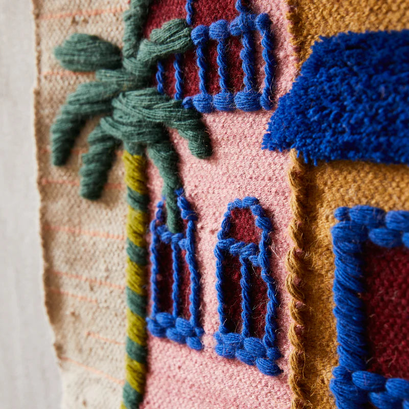 colourful decorative wall hanging made from wool
