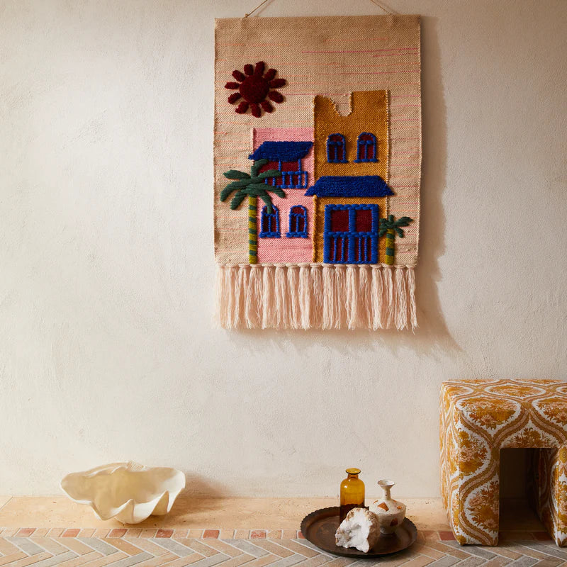 Matteo Wall Hanging by Sage & Clare - woven wool with colourful houses, palm trees and sun