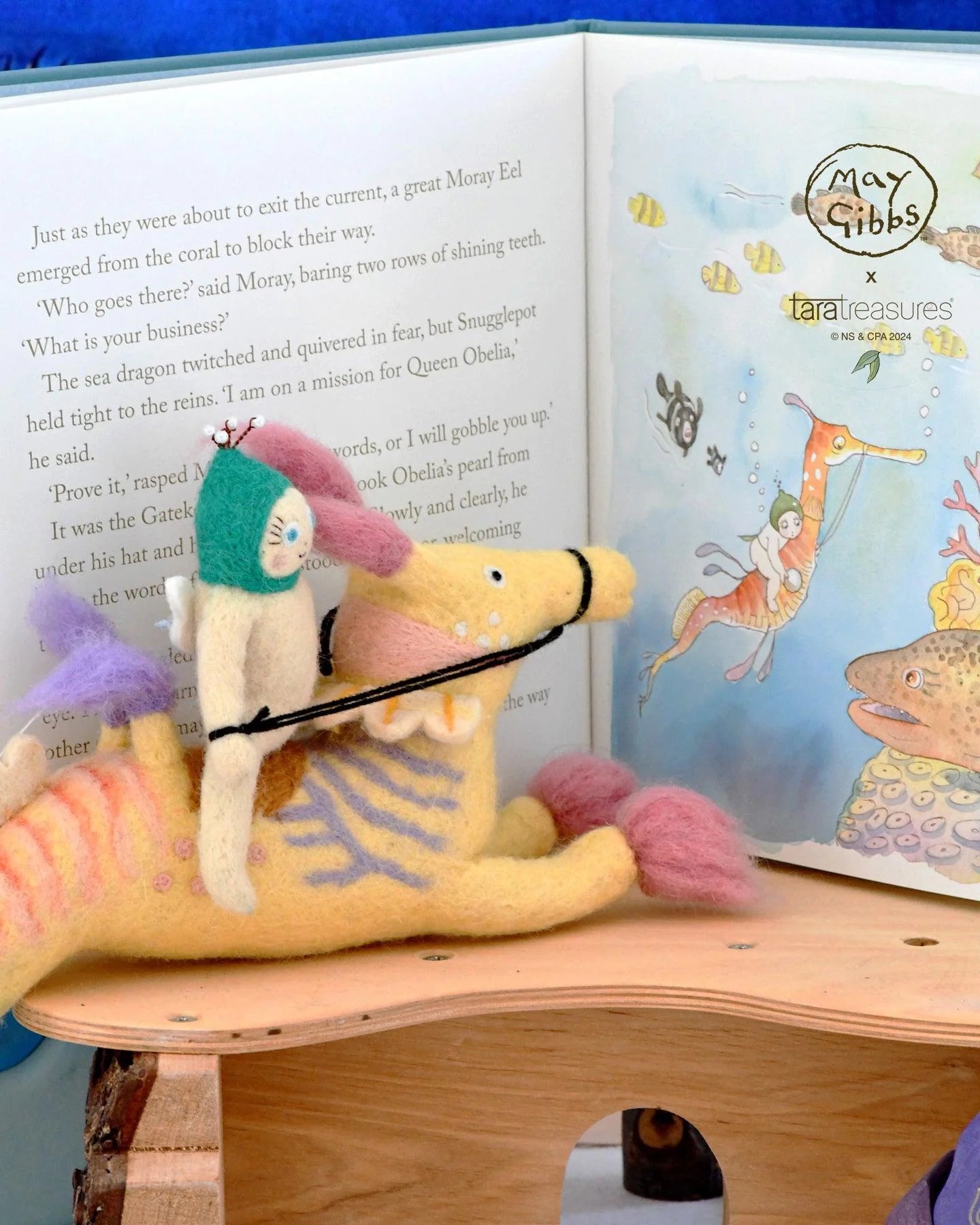 May Gibbs gumnut baby riding weedy sea dragon