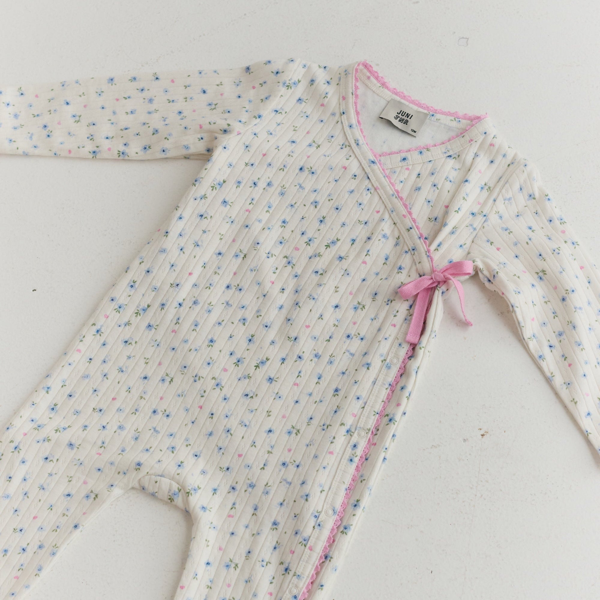 Button down baby onesie with tie feature organic cotton