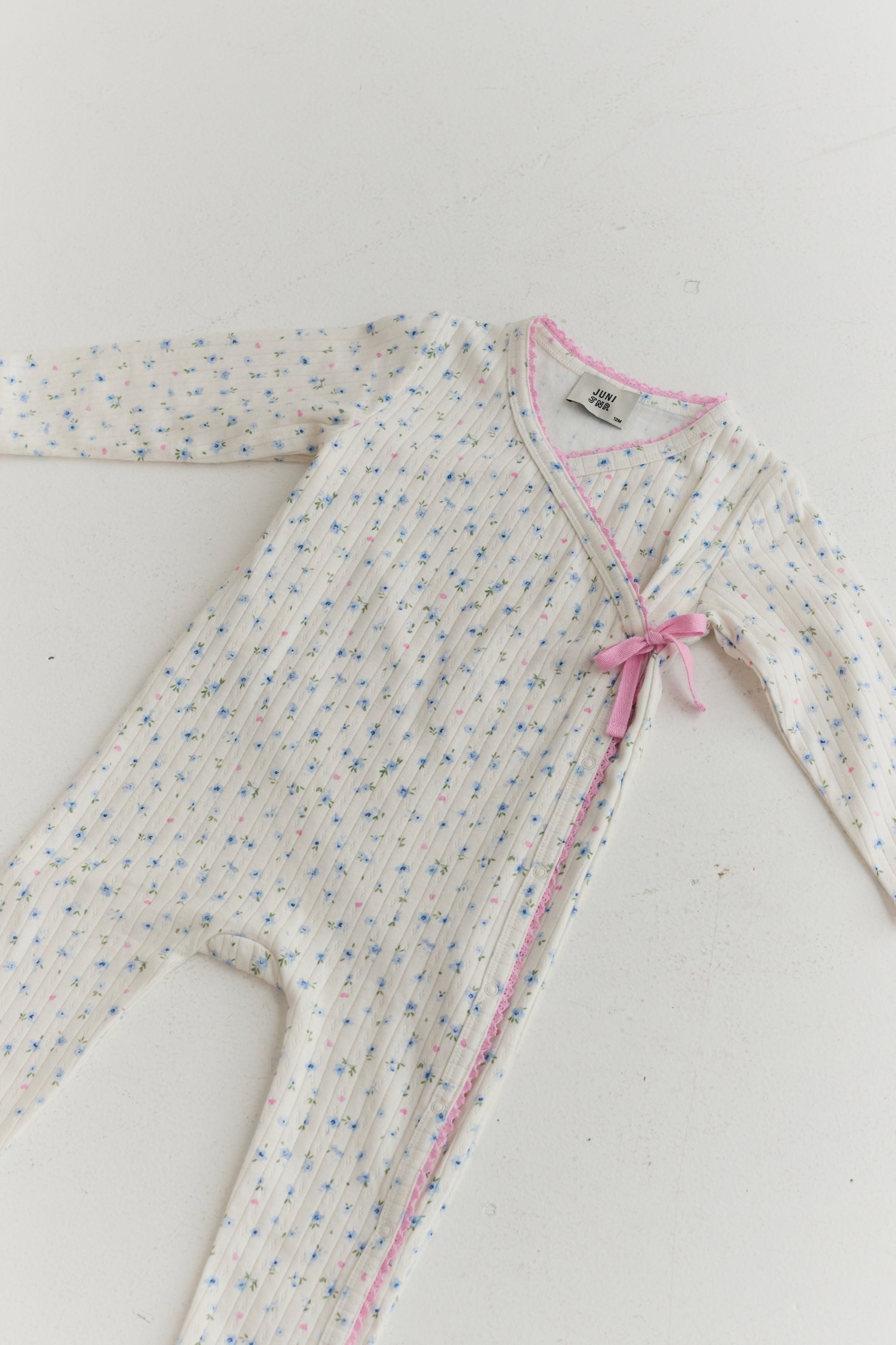 Button down baby onesie with tie feature organic cotton