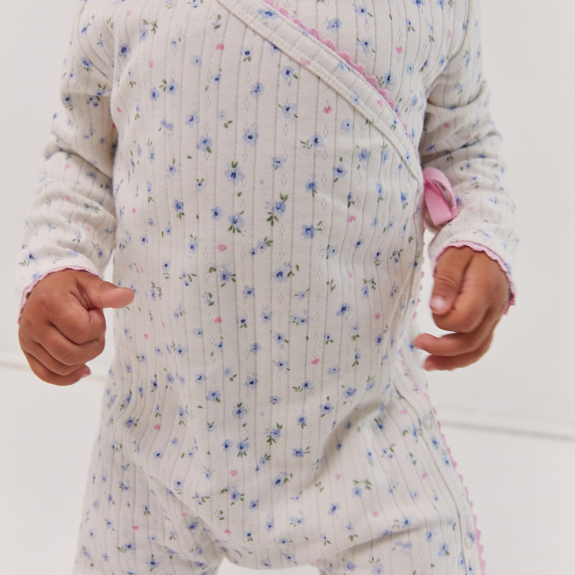 toddler wearing Pointelle baby bodysuit ethical fashion Juni brand