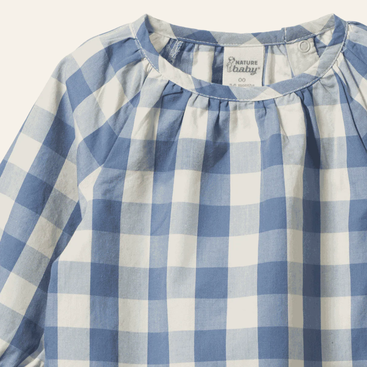 Close up on neckline of the Meadow Bodysuit Gingham - Bluebelle Check | Nature Baby