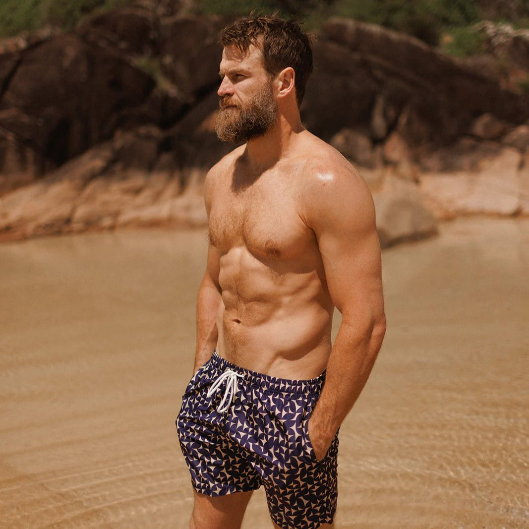 man wearing Swim shorts sapphire sand by Swim Shady with navy geometric print