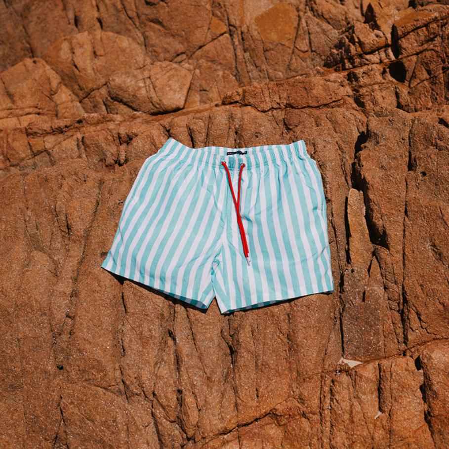 mens white and teal boardshorts by Swim Shady