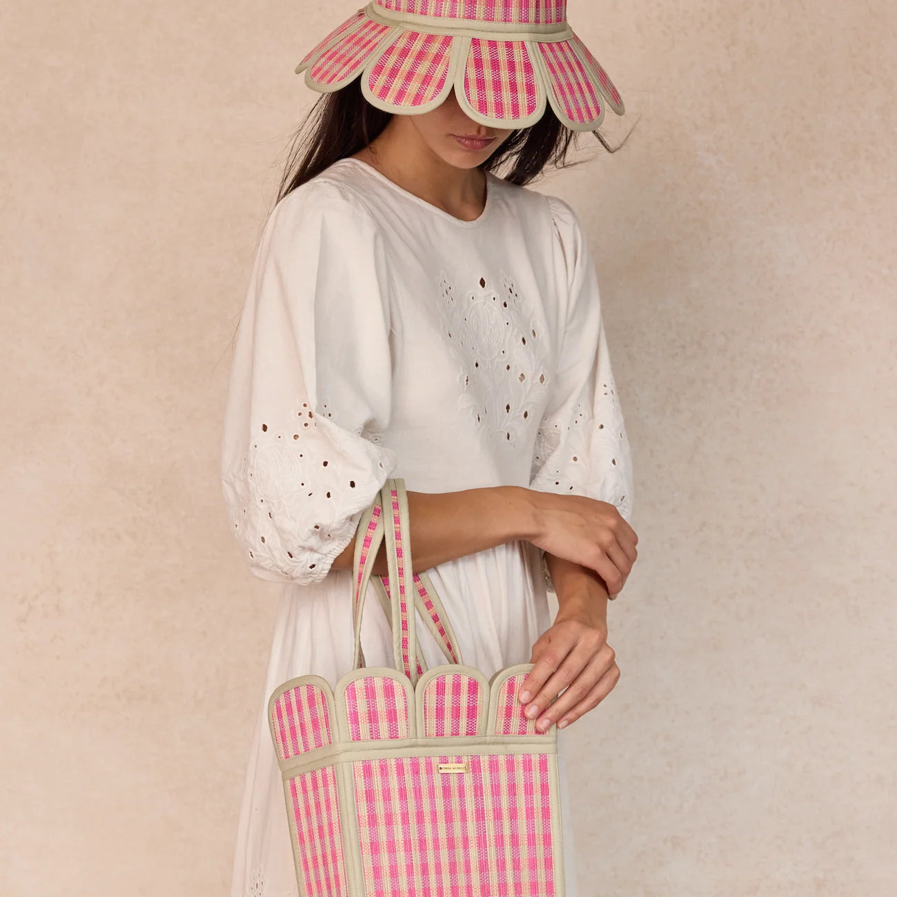 lady wearing Island Manhattan Hat – Mintberry by Lorna Murray and holding mintberry bag