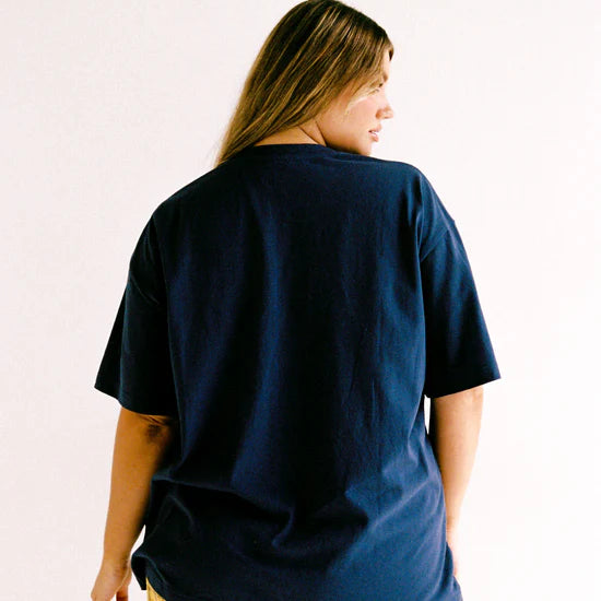 model back wearing Navy Garnet Tee by Juni