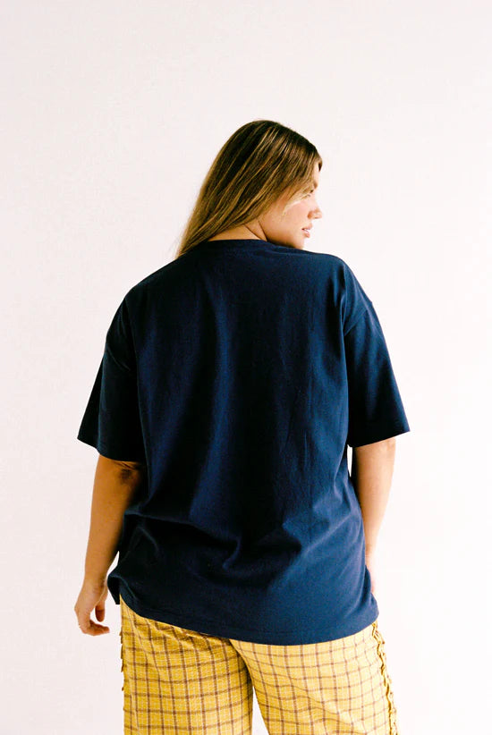 model back wearing Navy Garnet Tee by Juni