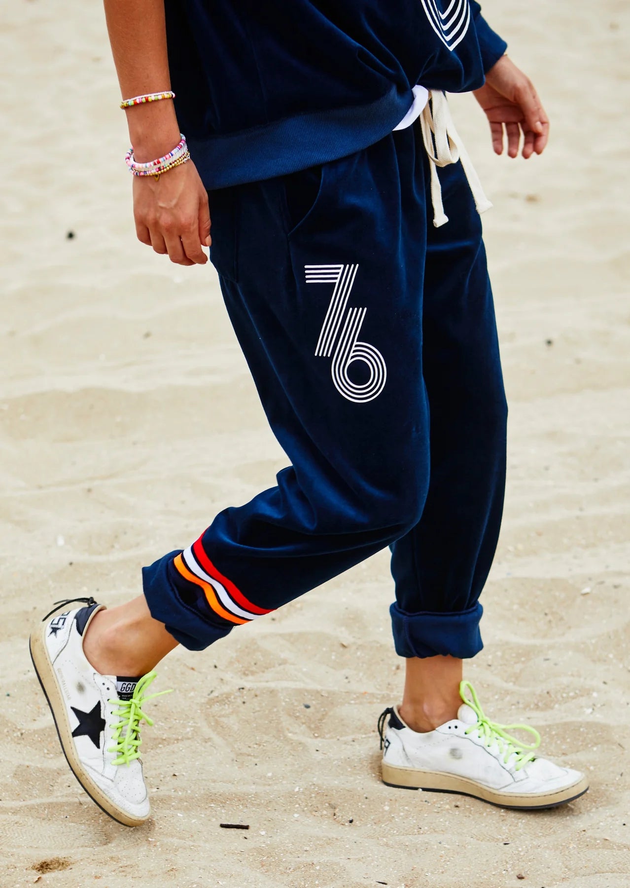 Retro 76 Navy Velour Track Pant by Hammill & Co close up of models wearing pants