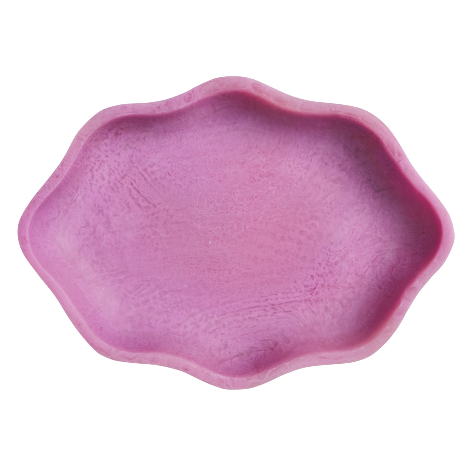 Overhead view of pink ceramic serving dish interior showing scalloped rim and textured bottom
