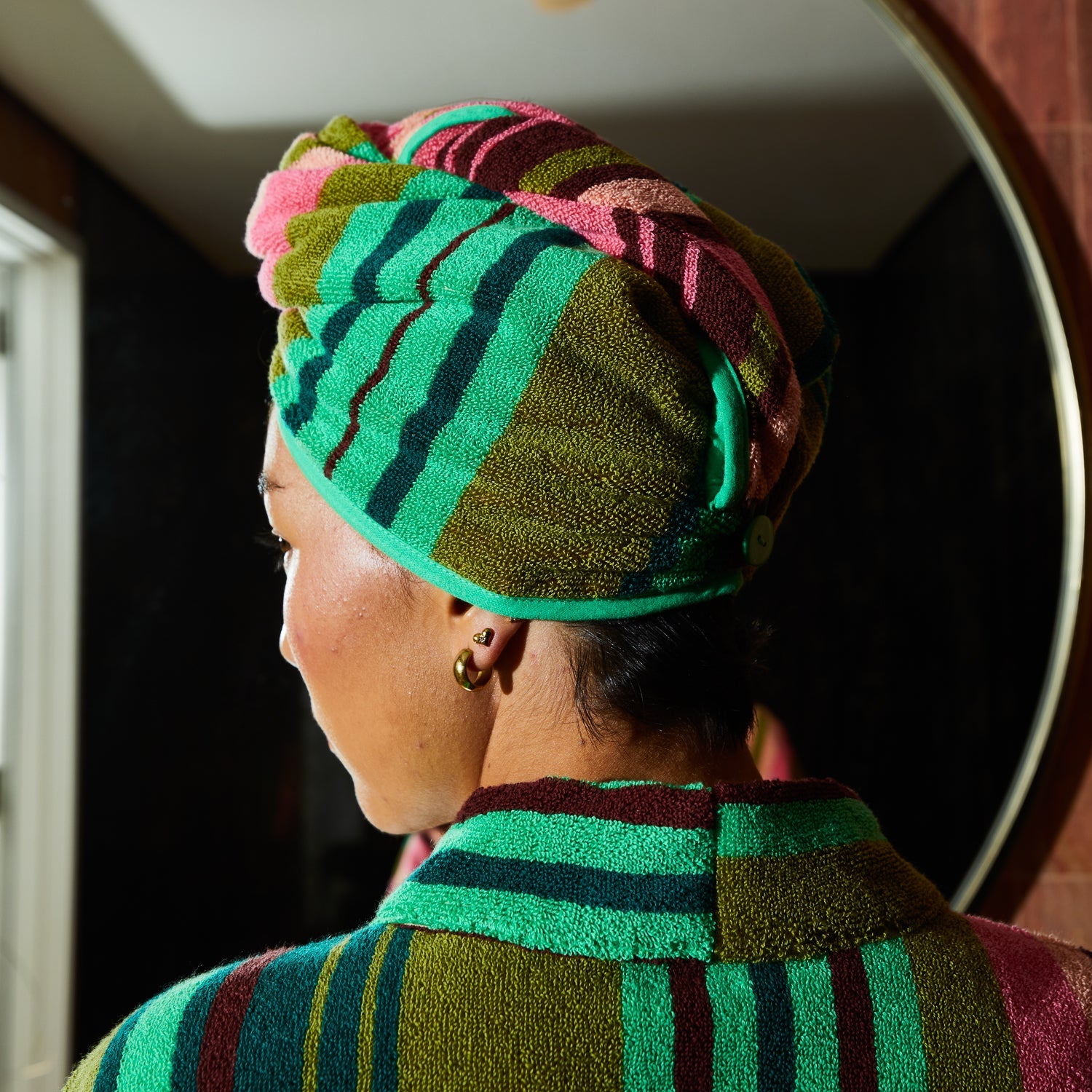 Elasticated loop and button closure detail on juniper Nicolette hair wrap