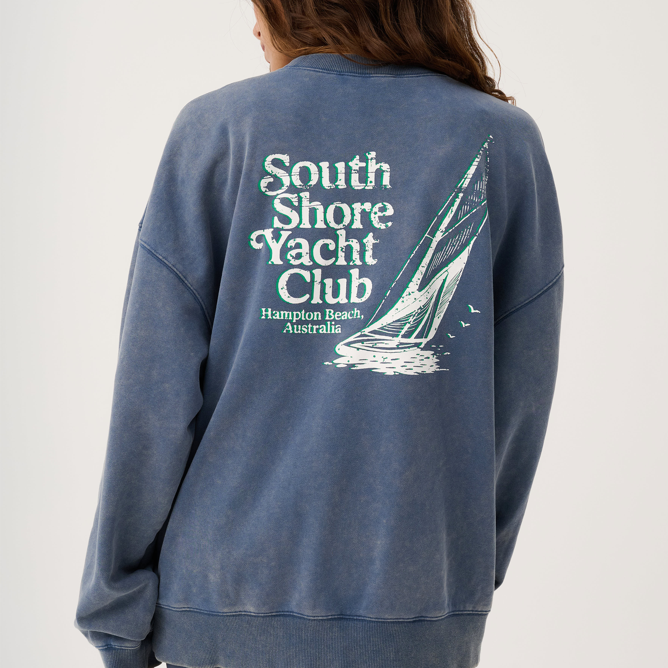 Back view of Nina Sweater showing South Shore Yacht Club graphic print with sailboat design