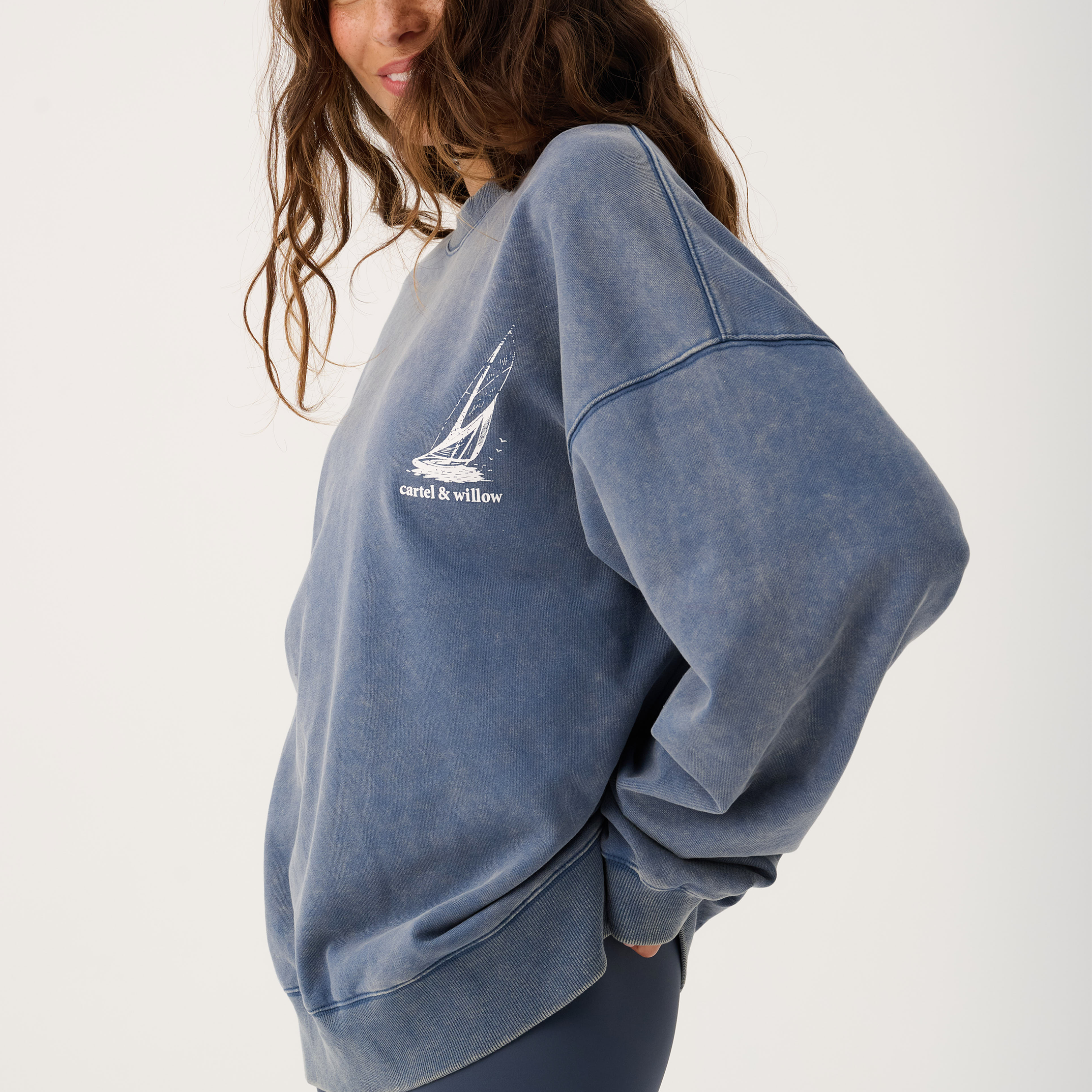 Side angle of Nina Sweater displaying relaxed oversized silhouette and ribbed cuffs and hem