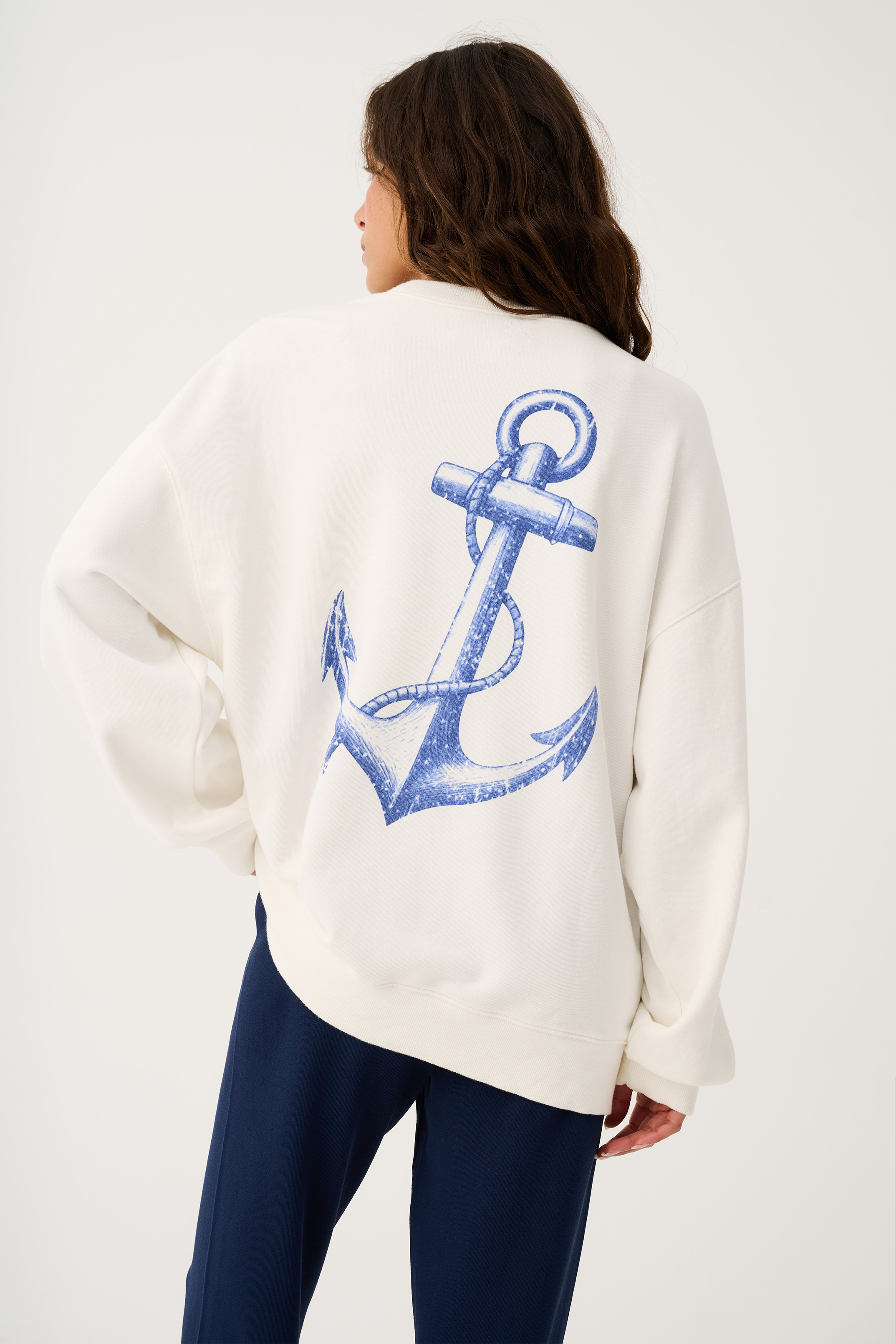 Back view of Nina Sweater in white showing large blue anchor graphic print
