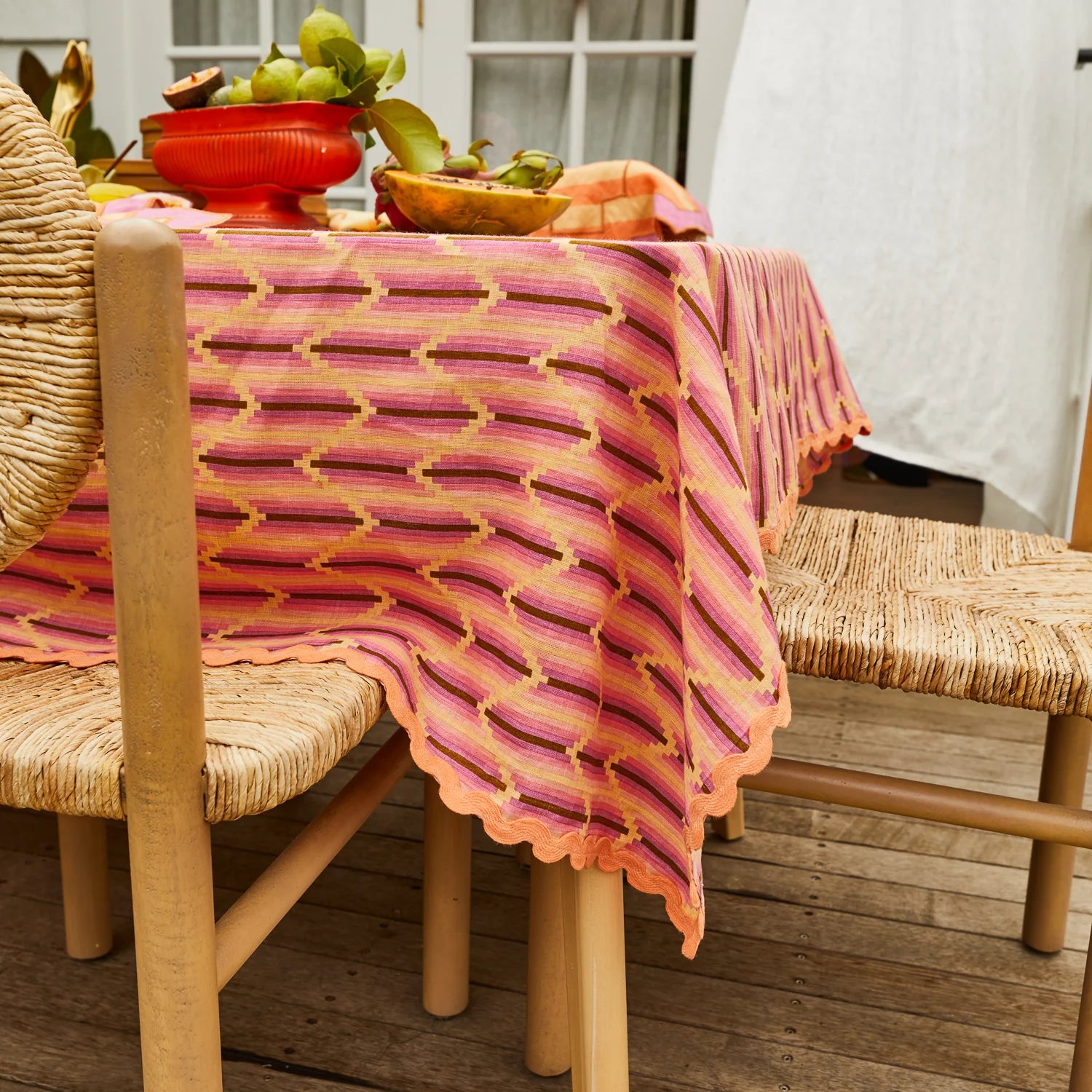 Nisha Tablecloth Posy by Sage & Clare displayed on outdoor wooden table