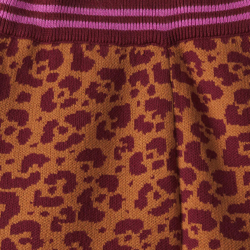 Fabric detail of Odette Kids Knit Pants in leopard print with pink stripes by Sage and Clare