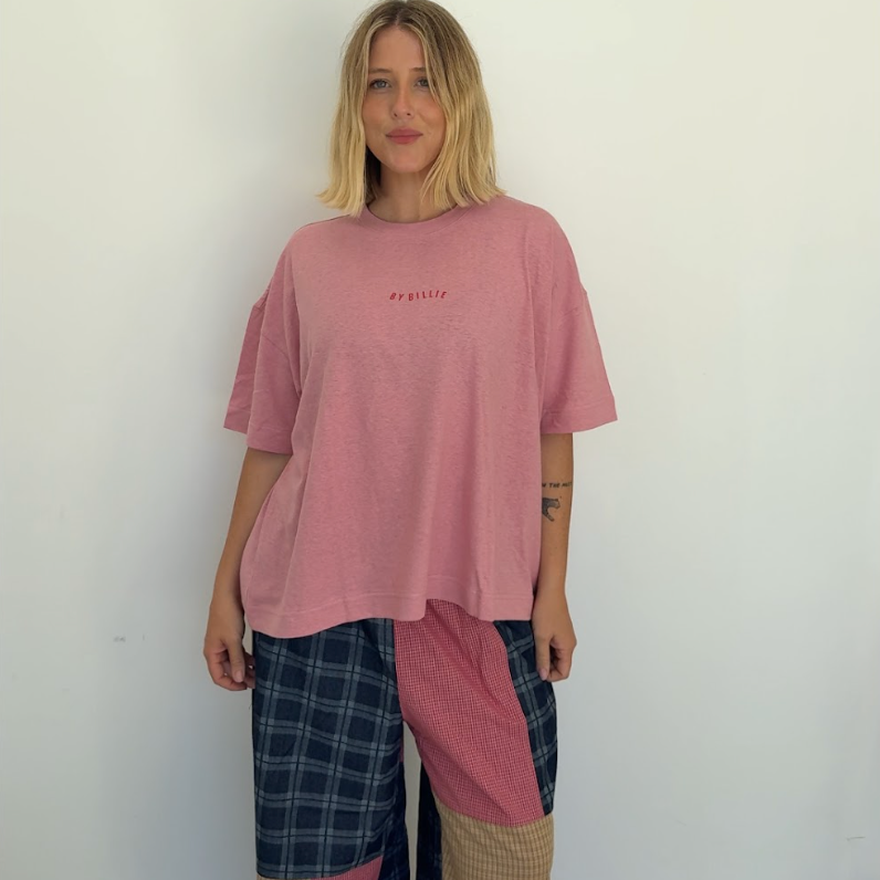 Full length view of Olive Checkerboard Pant displaying patchwork colorblocking and loose fit