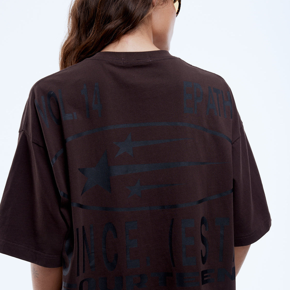 Back view of Sport Star Tee showing blue graphic print with stars and text design