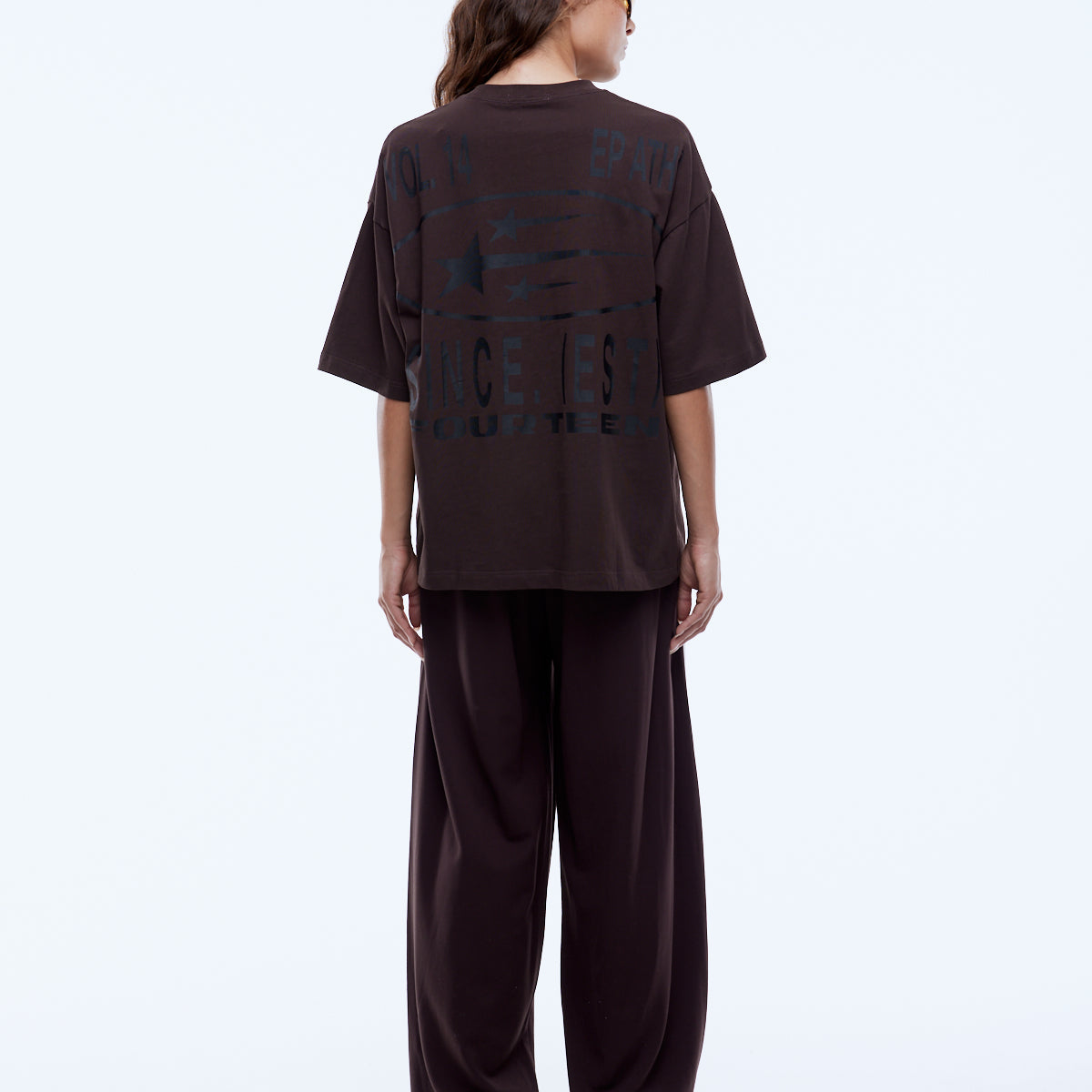 Back view of Sport Star Tee displaying full graphic design with stars and vintage-style text