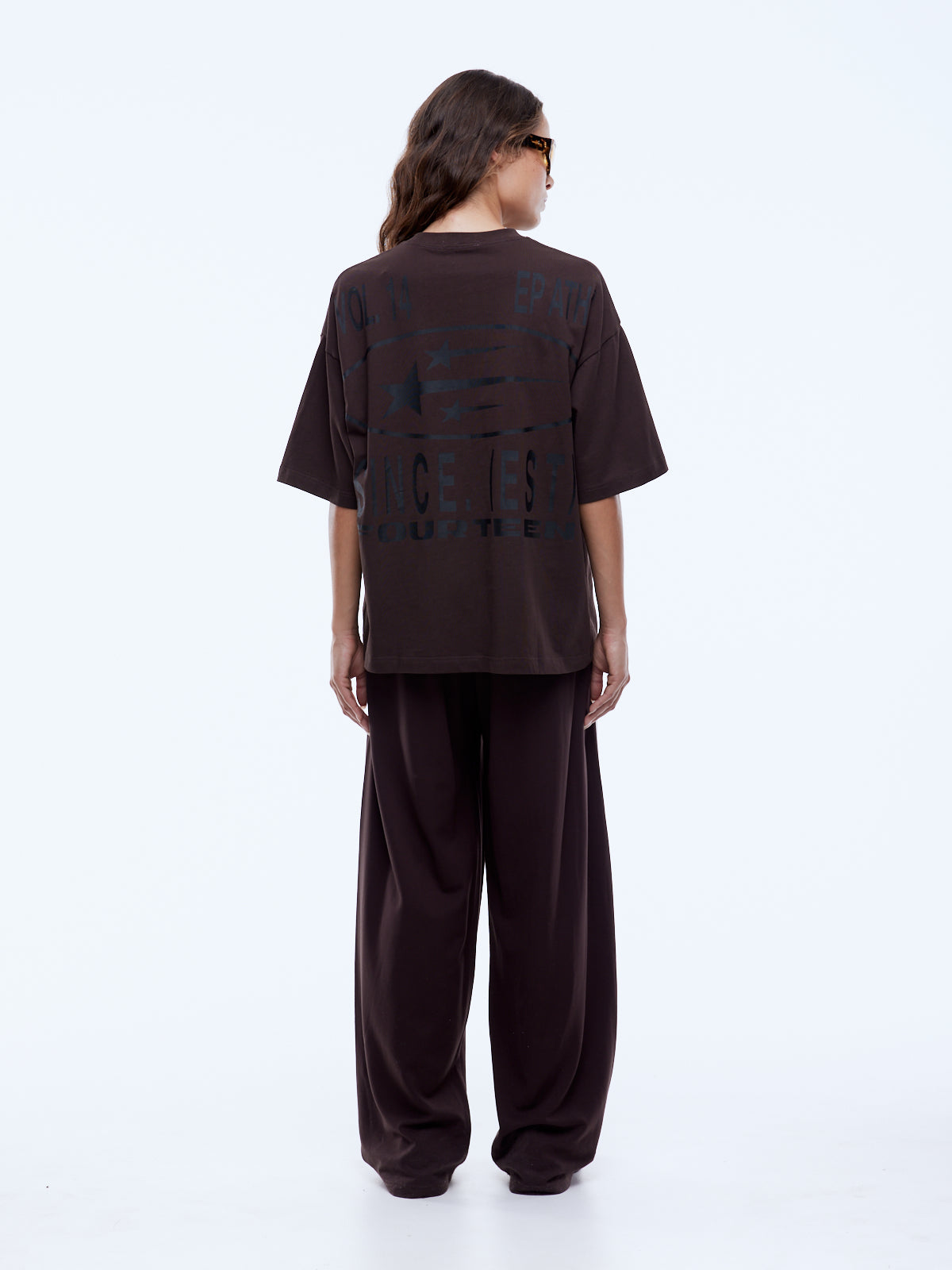 Back view of Sport Star Tee displaying full graphic design with stars and vintage-style text