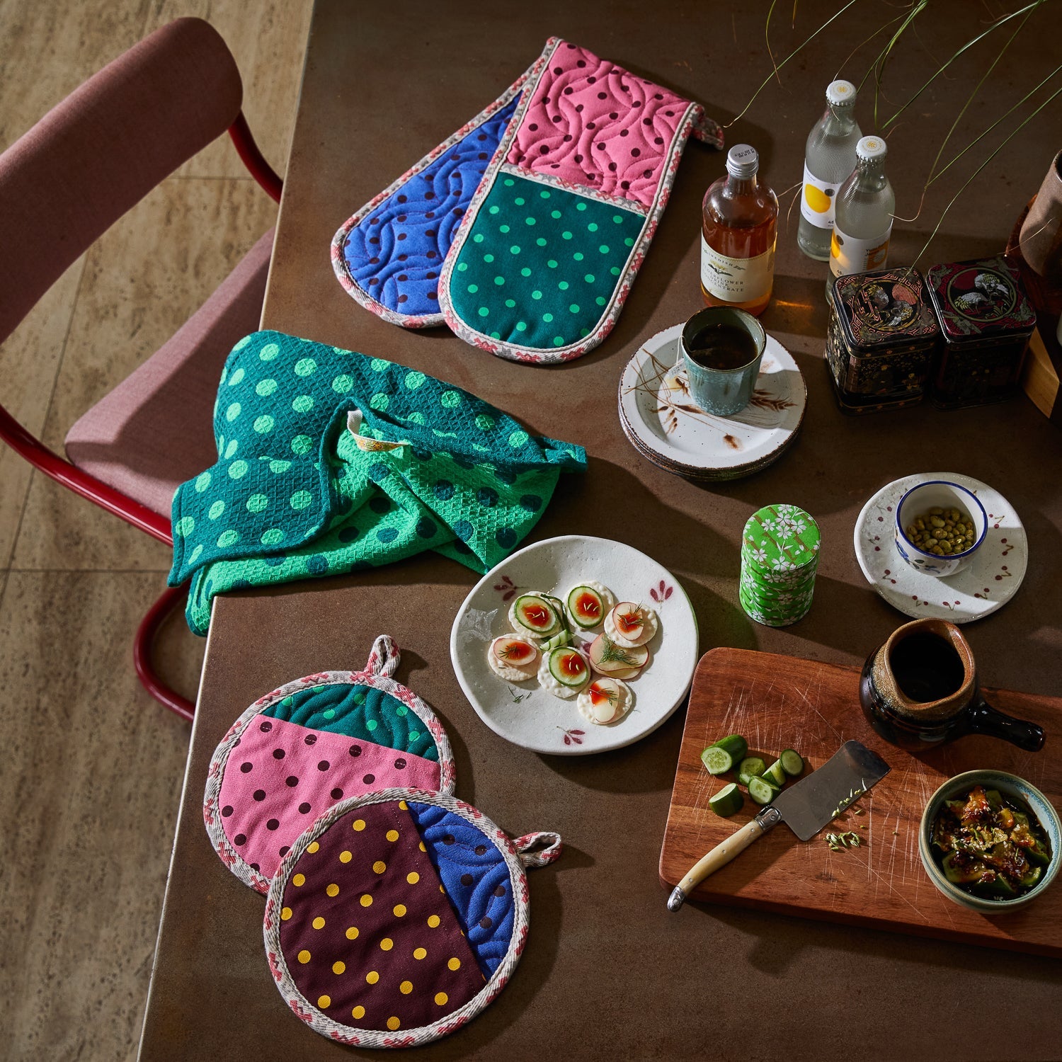 Kitchen styling with Paige Double Oven Mitt displayed with coordinating polka dot pot holders and tableware