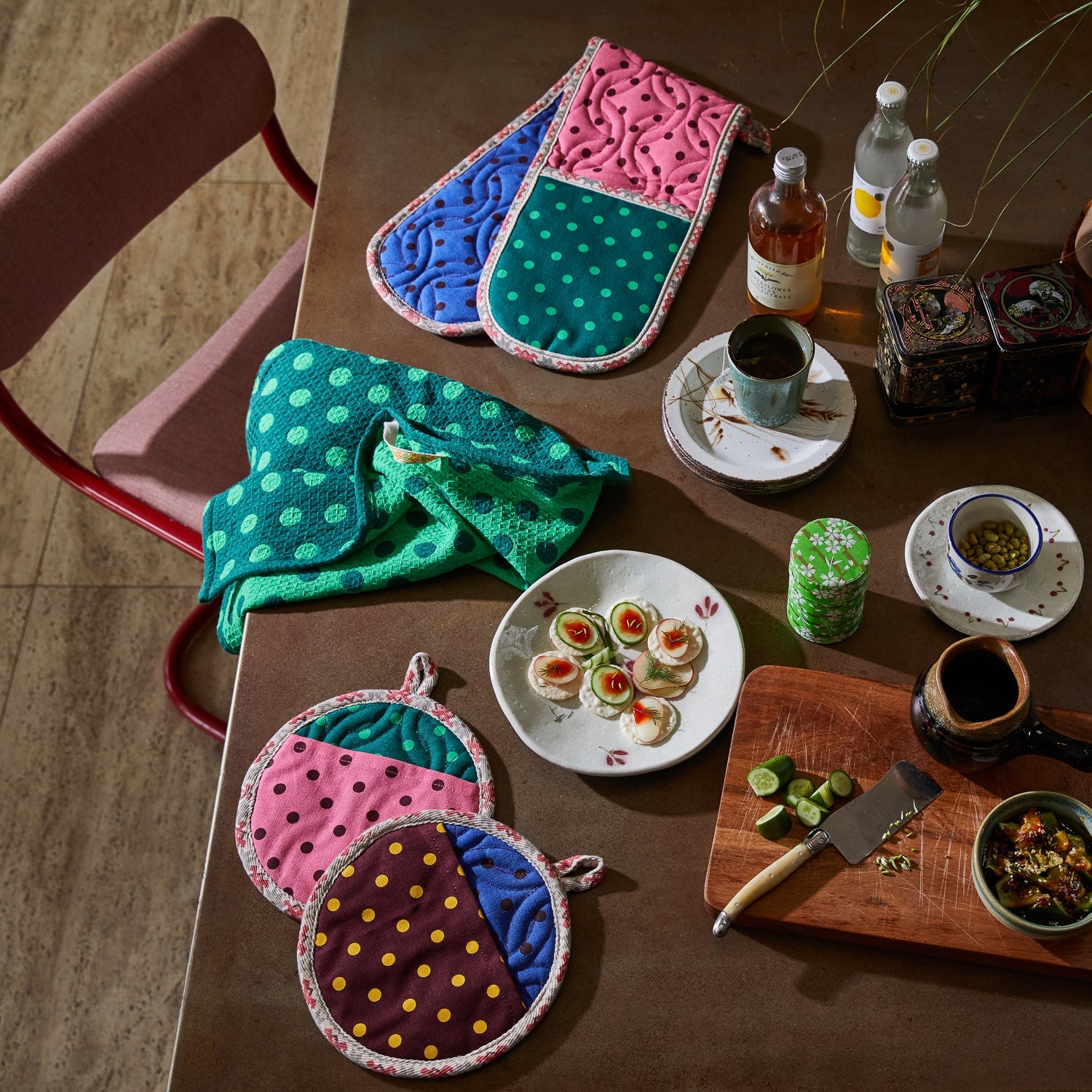 Overhead view of Paige pot holders with matching tea towel and kitchen accessories by Sage & Clare