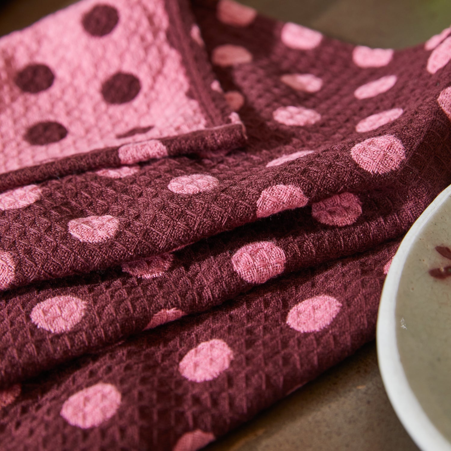 Close-up of waffle weave texture on Paige Tea Towel Rosewood showing absorbent fabric and spot pattern detail