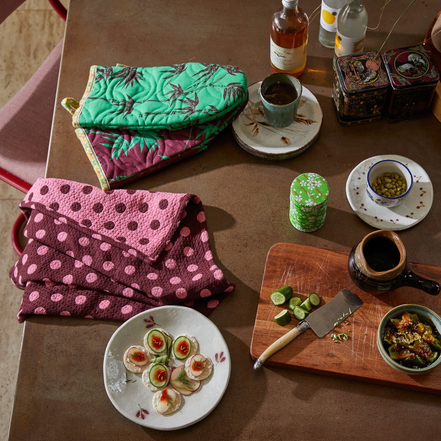 Overhead view of Paige Tea Towels Rosewood with kitchen prep items showing waffle texture and polka dot design