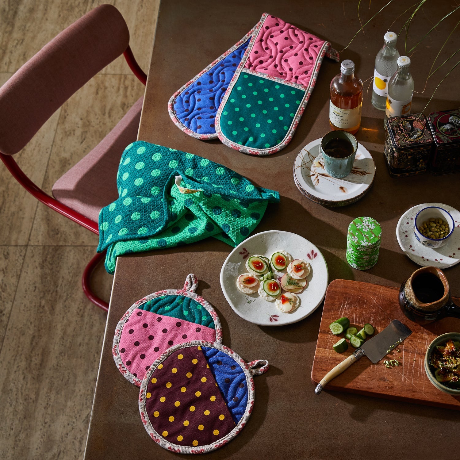 Sage & Clare Paige Tea Towels displayed with colorful pot holders in kitchen dining setting waffle weave