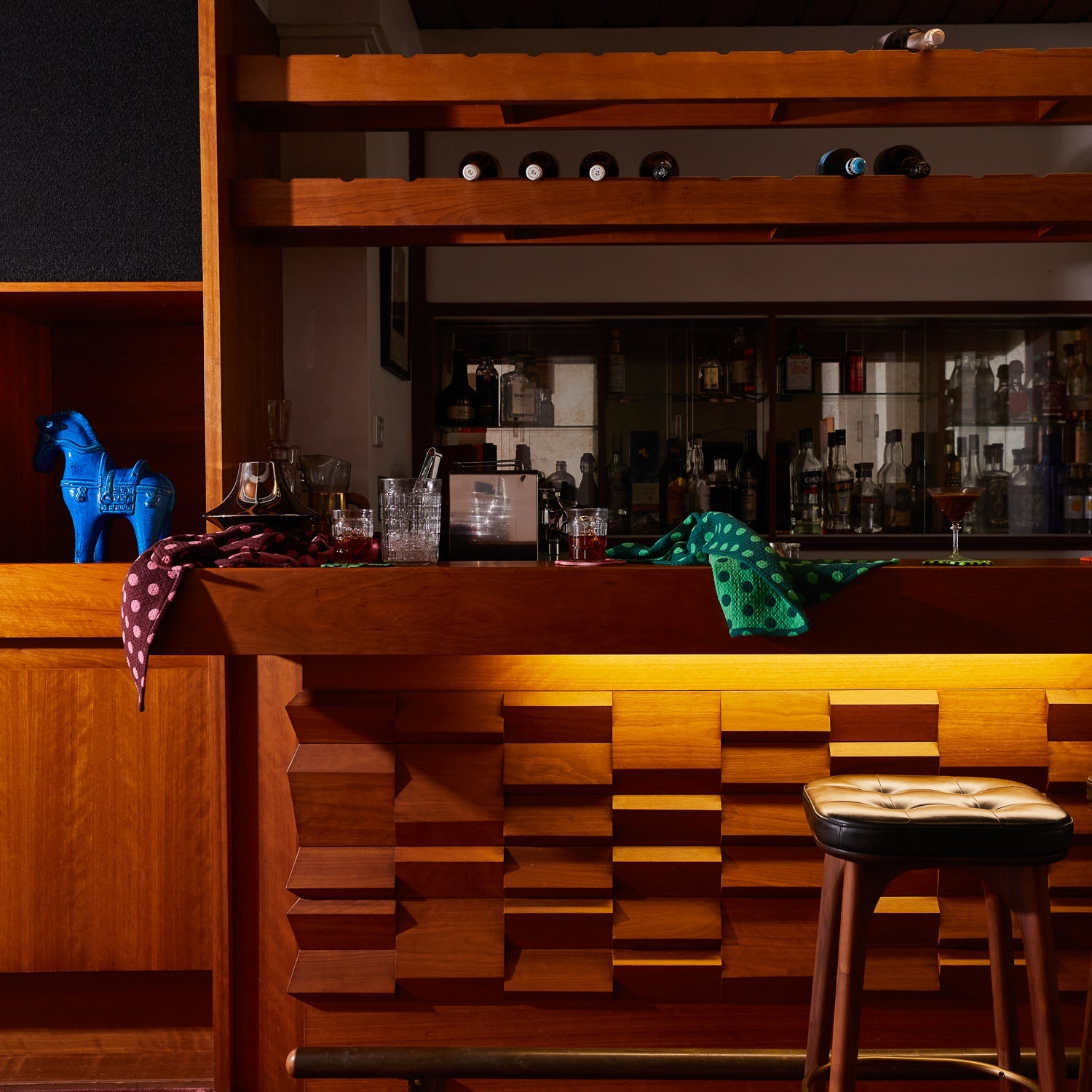 Kitchen bar scene featuring Paige Tea Towel Verdant with wine bottles and waffle weave texture