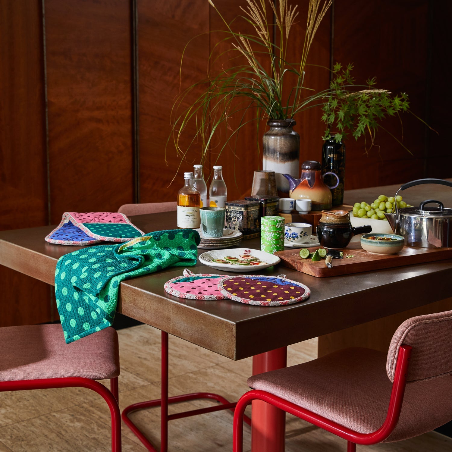 Dining table styling with Paige Tea Towel Verdant and colorful pot holders waffle weave kitchen linens