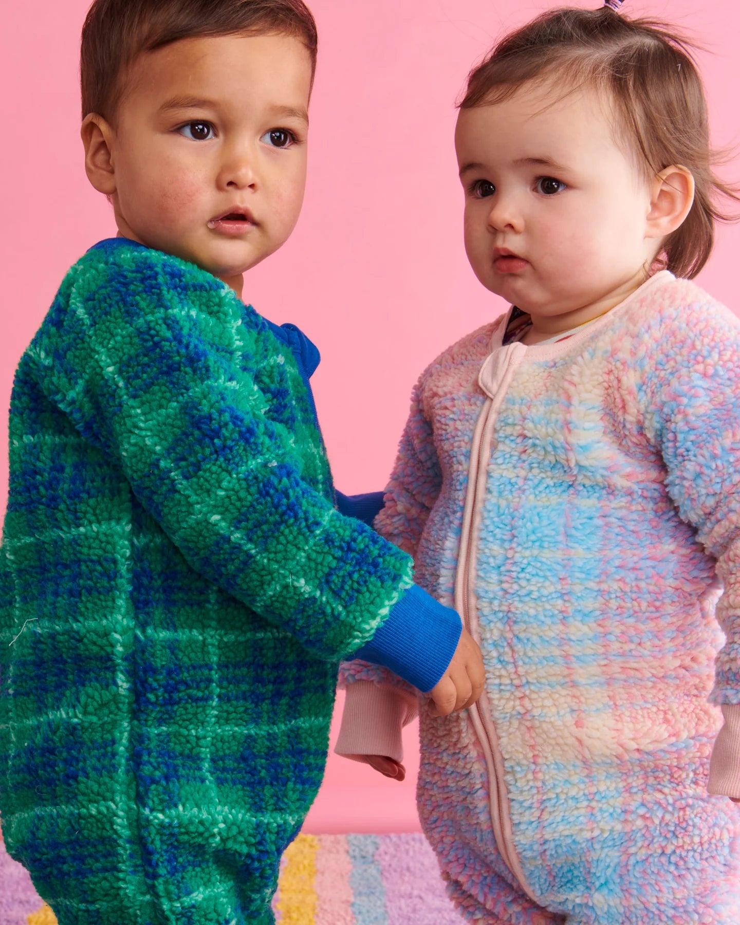 infant winter jumpsuit in blue & green and infant winter jumpsuit in pink pastel