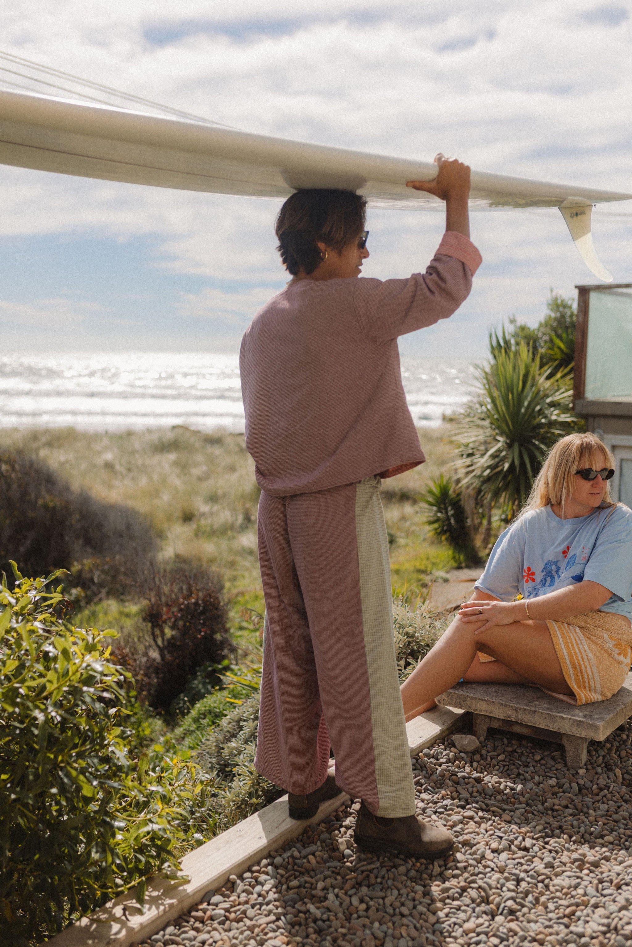 Framed view of woman in Atmosea Patchwork Pant Houndstooth Combo at coastal location