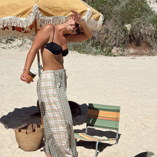 Lady on beach wearing Patchwork Pant in Cottage Plaid | Atmosea