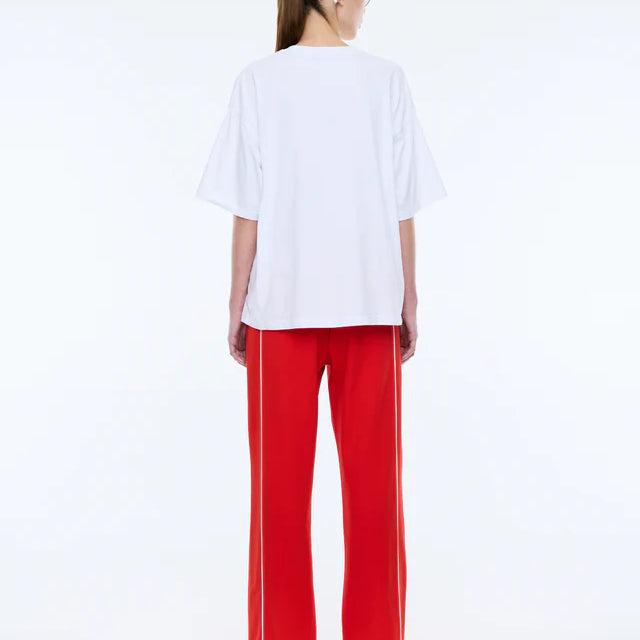 back view of model wearing Pelly Sport Tee White by Ena Pelly