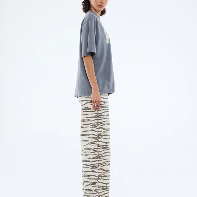 side view fo model wearing Pelly World Tour Tee - Washed Grey by Ena Pelly