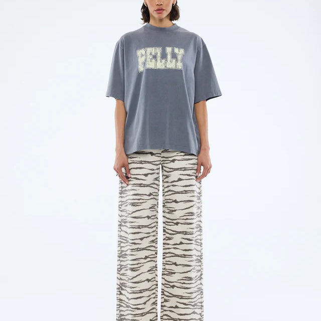 model wearing the grey tshirt with cream logo graphic - Pelly World Tour Tee - Washed Grey by Ena Pelly