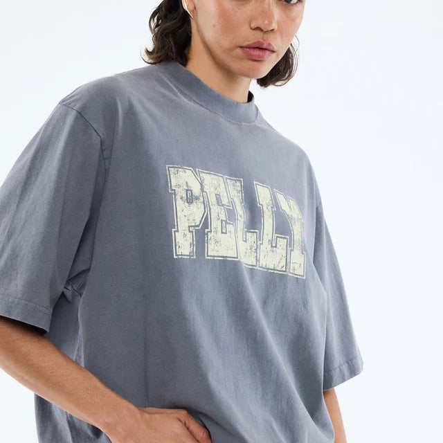 Grey tshirt with the word "Pelly" in offwhite across the front
