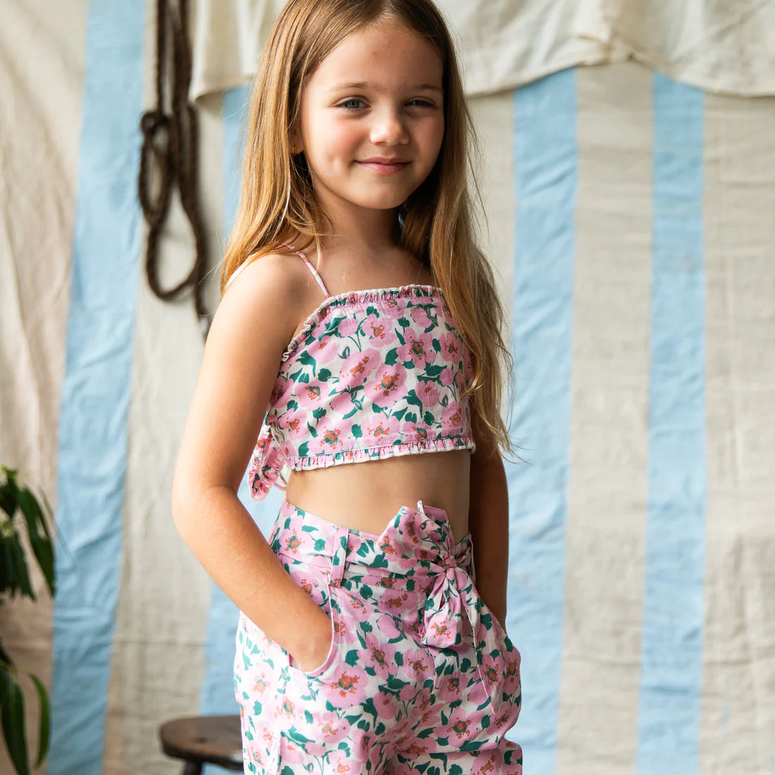 girl wearing Penny Top – Sakura by Pearson & Pearson with pink and green flowers